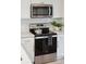 Updated kitchen featuring stainless steel appliances, white cabinets, quartz countertops, and modern lighting at 5573 Betty Ct, North Charleston, SC 29418