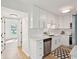 Well-lit kitchen with stainless appliances, quartz countertops, modern cabinets, and tile floors at 5573 Betty Ct, North Charleston, SC 29418
