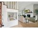 Open-concept living room with fireplace, staircase, and wood floors at 5573 Betty Ct, North Charleston, SC 29418