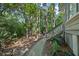 Charming backyard walkway with a built-in grill and access to the staircase at 597 Oyster Rake Dr, Kiawah Island, SC 29455