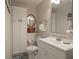 Bathroom featuring a white vanity with an oversized mirror and decorative tile flooring at 597 Oyster Rake Dr, Kiawah Island, SC 29455