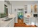 Bright white kitchen with stainless appliances open to the living room at 597 Oyster Rake Dr, Kiawah Island, SC 29455