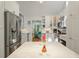 Bright, white kitchen with stainless appliances opens to living space at 597 Oyster Rake Dr, Kiawah Island, SC 29455