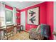 Bright, vibrant office space with desk, patterned rug, and unique bird artwork at 597 Oyster Rake Dr, Kiawah Island, SC 29455
