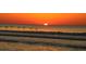 Beautiful sunrise over the ocean with birds flying over the waves, capturing a serene coastal moment at 597 Oyster Rake Dr, Kiawah Island, SC 29455