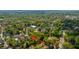 An aerial view showcases the neighborhood, lined with mature trees and traditional-style homes in a serene setting at 617 Hampton St, Walterboro, SC 29488