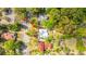 Aerial view pointing to a charming home nestled among trees, surrounded by residential streets and houses at 617 Hampton St, Walterboro, SC 29488