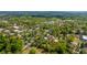 An aerial view showcases the neighborhood, lined with mature trees and traditional-style homes in a serene setting at 617 Hampton St, Walterboro, SC 29488