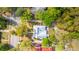 Overhead view shows a home with a metal roof amid lush trees, streets, and neighboring houses at 617 Hampton St, Walterboro, SC 29488