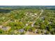 An aerial view showcases the neighborhood, lined with mature trees and traditional-style homes in a serene setting at 617 Hampton St, Walterboro, SC 29488