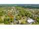 An aerial view showcases the neighborhood, lined with mature trees and traditional-style homes in a serene setting at 617 Hampton St, Walterboro, SC 29488