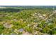 An aerial view showcases the neighborhood, lined with mature trees and traditional-style homes in a serene setting at 617 Hampton St, Walterboro, SC 29488