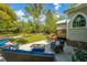 Inviting back patio with comfortable seating, ideal for outdoor relaxation and gatherings, set against a backdrop of lush greenery at 617 Hampton St, Walterboro, SC 29488
