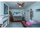 Comfortable bedroom featuring a cozy sofa, decorative fireplace, and nautical-themed decor, exuding a relaxing ambiance at 617 Hampton St, Walterboro, SC 29488