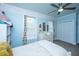 Comfortable bedroom with light-blue walls, white furniture, carpeted floors, and ceiling fan at 617 Hampton St, Walterboro, SC 29488