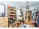 Charming closet with shoe rack, chandelier, and view into the ensuite bathroom at 617 Hampton St, Walterboro, SC 29488