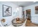 Cozy dining area with a wood table, modern light fixture, and shiplap walls at 617 Hampton St, Walterboro, SC 29488