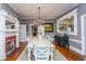 Elegant dining room features a fireplace, hardwood floors, and light-colored walls at 617 Hampton St, Walterboro, SC 29488