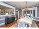 Dining room with hardwood floors, light-colored walls, and view of kitchen at 617 Hampton St, Walterboro, SC 29488