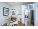 Kitchen features white cabinets, stainless steel appliances, and a cozy dining area at 617 Hampton St, Walterboro, SC 29488