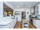 Bright kitchen featuring white cabinets, stainless steel appliances, and an island at 617 Hampton St, Walterboro, SC 29488