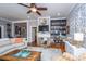 Comfortable living room with hardwood floors and a built-in bookshelf and fireplace at 617 Hampton St, Walterboro, SC 29488