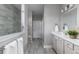 Bright bathroom with walk-in shower, dual vanity, and neutral tile at 630 Coral Bells Ln, Summerville, SC 29486