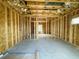 View of the home under construction, featuring a wood frame and window at 715 Blueway Ave, Summerville, SC 29486