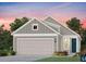 Charming one-story home showcasing gray siding, a two-car garage, and a welcoming front entrance at 725 Blue Iris Way, Summerville, SC 29486
