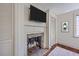 Bedroom featuring brick fireplace, closet, and wood floors offering a cozy and functional space at 73 Anson St, Charleston, SC 29401