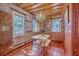 Bright dining area with hardwood floors, chandelier, and rustic wood paneling, perfect for intimate gatherings at 73 Anson St, Charleston, SC 29401