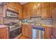 Well-equipped kitchen features stainless steel appliances, tiled backsplash, and cabinetry at 73 Anson St, Charleston, SC 29401