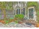 Inviting front patio with outdoor seating and lush landscaping providing a tranquil entrance at 73 Anson St, Charleston, SC 29401