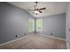 Spacious bedroom with vaulted ceiling, ceiling fan, carpet and double windows at 8499 Falling Leaf Ln, North Charleston, SC 29420