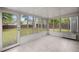 Bright sunroom with tile floors, large windows and exterior access to backyard at 8499 Falling Leaf Ln, North Charleston, SC 29420