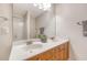 Bathroom featuring double vanity, large mirror, and shower with glass door at 9028 Parlor Dr, Ladson, SC 29456