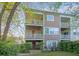 Multi-story exterior shows balconies with white railings and tan siding at 9028 Parlor Dr, Ladson, SC 29456