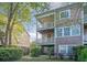 Exterior view of townhomes with backyard patios and landscaping at 9028 Parlor Dr, Ladson, SC 29456
