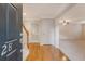 Home foyer with wood floors and staircase at 9028 Parlor Dr, Ladson, SC 29456