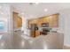 Bright kitchen featuring wood cabinets, stainless steel appliances, and a spacious breakfast bar at 9028 Parlor Dr, Ladson, SC 29456