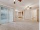 Open-concept living room featuring neutral carpet and a ceiling fan at 9028 Parlor Dr, Ladson, SC 29456