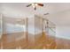 Spacious living room featuring hardwood floors, wainscoting, and staircase to upper level at 9028 Parlor Dr, Ladson, SC 29456