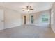 Spacious bedroom featuring a door to a balcony, large window, and ensuite bathroom at 9028 Parlor Dr, Ladson, SC 29456