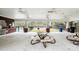 Community pavilion with picnic tables, BBQ and views of the fenced pool area at 9028 Parlor Dr, Ladson, SC 29456