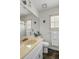 Well-lit bathroom with a faux marble countertop, decorative fish accents, and a full-sized mirror at 956 Provincial Cir, Mount Pleasant, SC 29464
