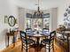 Dining room featuring a bay window, hardwood floors, and elegant decor at 956 Provincial Cir, Mount Pleasant, SC 29464