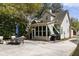 Charming home exterior featuring a sunroom, well-maintained siding, and a spacious concrete patio at 956 Provincial Cir, Mount Pleasant, SC 29464