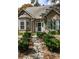 Close up of welcoming front entrance with stone path and lush landscaping at 956 Provincial Cir, Mount Pleasant, SC 29464