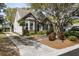 Inviting home exterior featuring a long driveway and beautifully maintained landscape at 956 Provincial Cir, Mount Pleasant, SC 29464