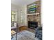 Inviting living room showcasing a brick fireplace, comfortable sofa, and stylish decor at 956 Provincial Cir, Mount Pleasant, SC 29464